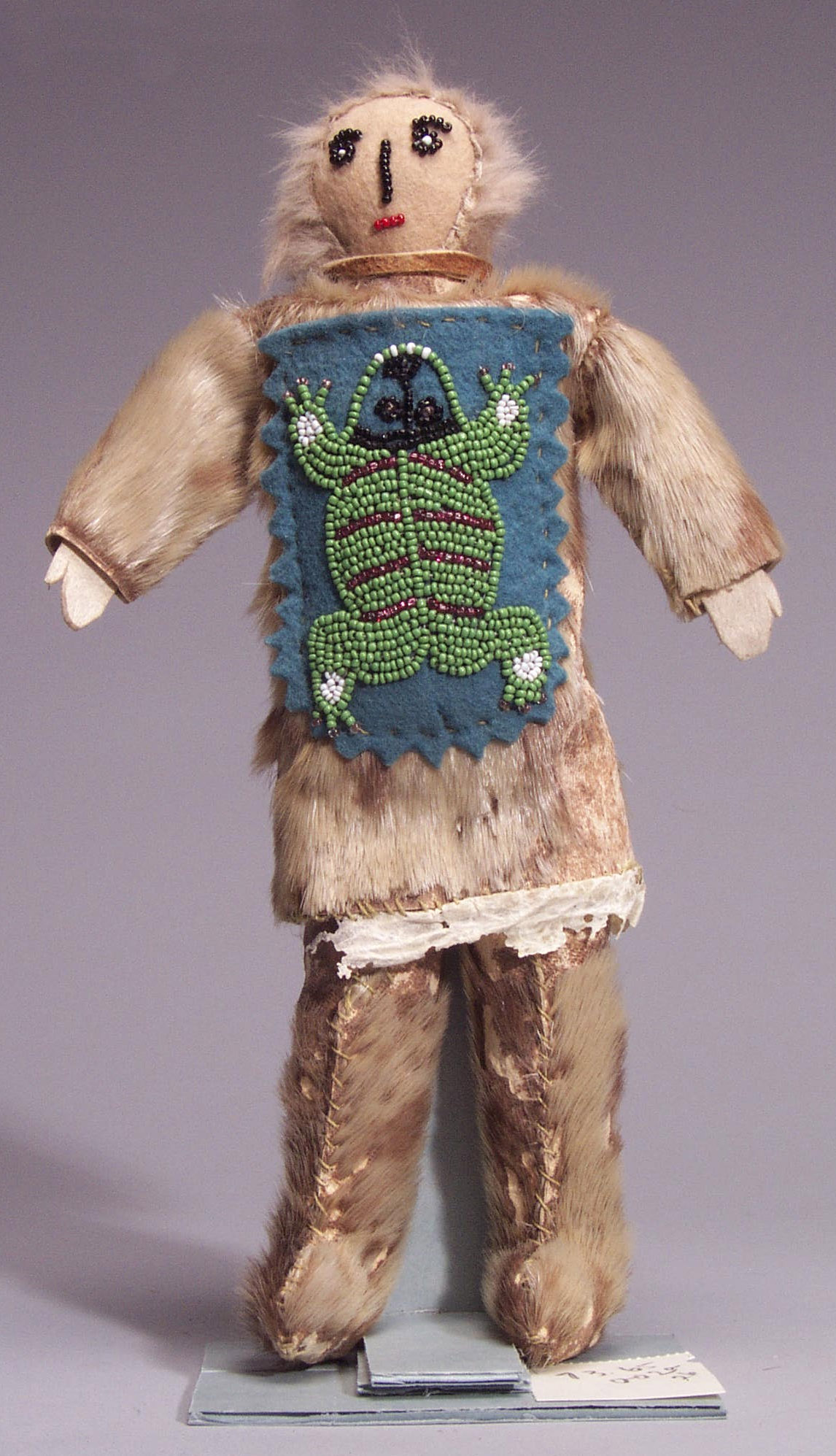 Doll with baby carrier, c. 1935