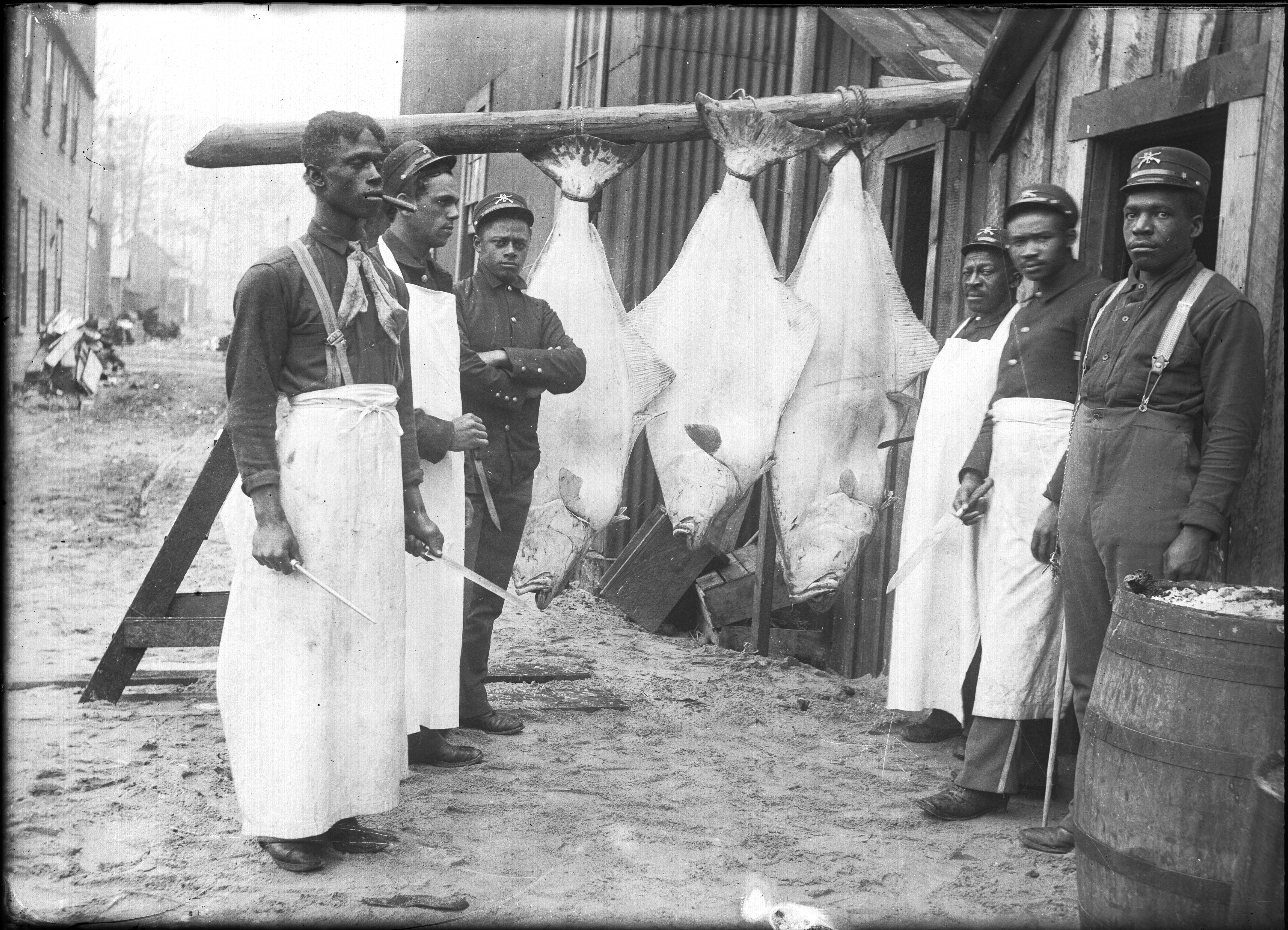 Six soldiers with three halibut, Skagway, c. 1896-1913