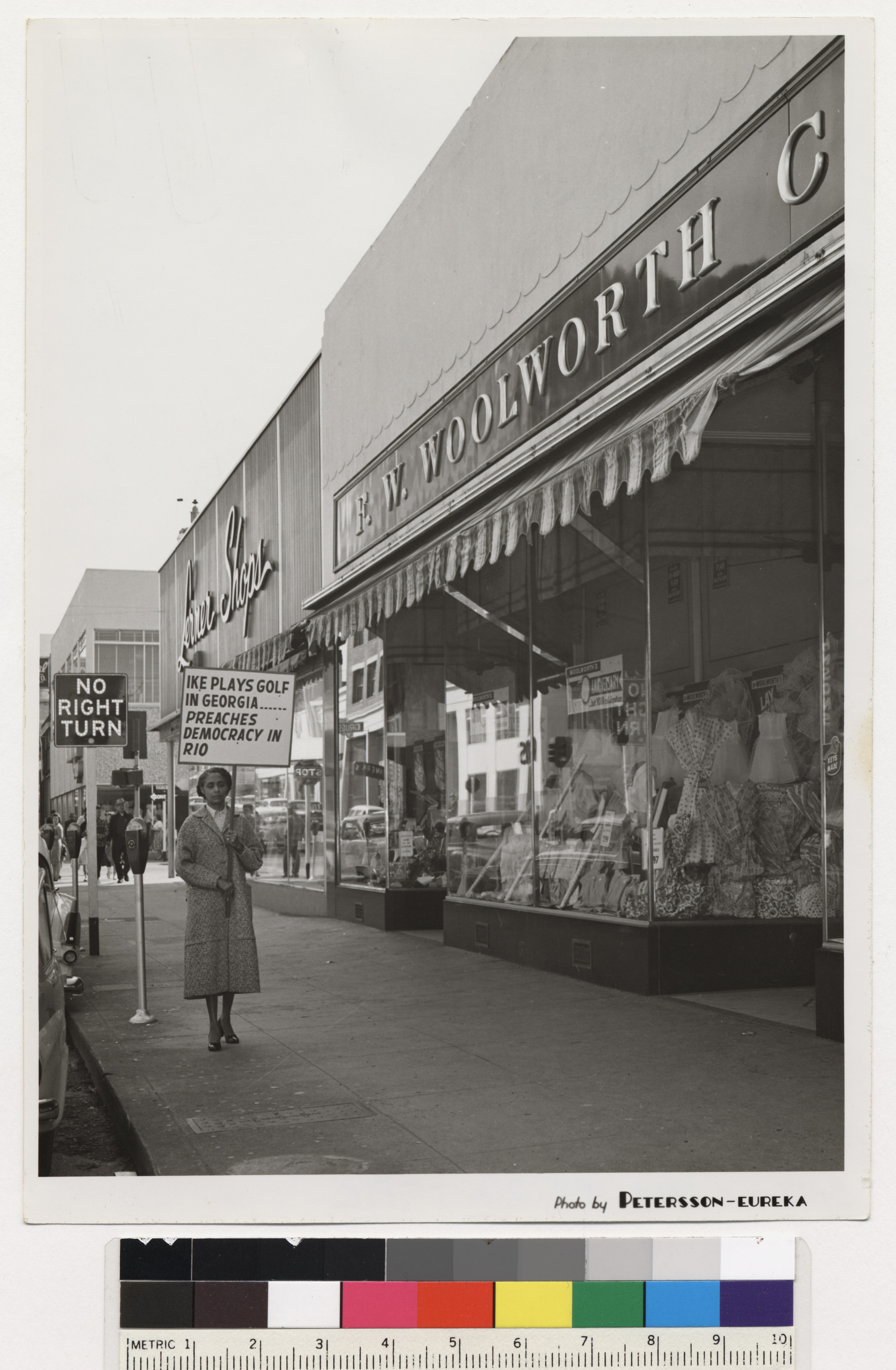 Woman picketing outside FW Woolworth Company Store, Fairbanks, Alaska, c. 1960