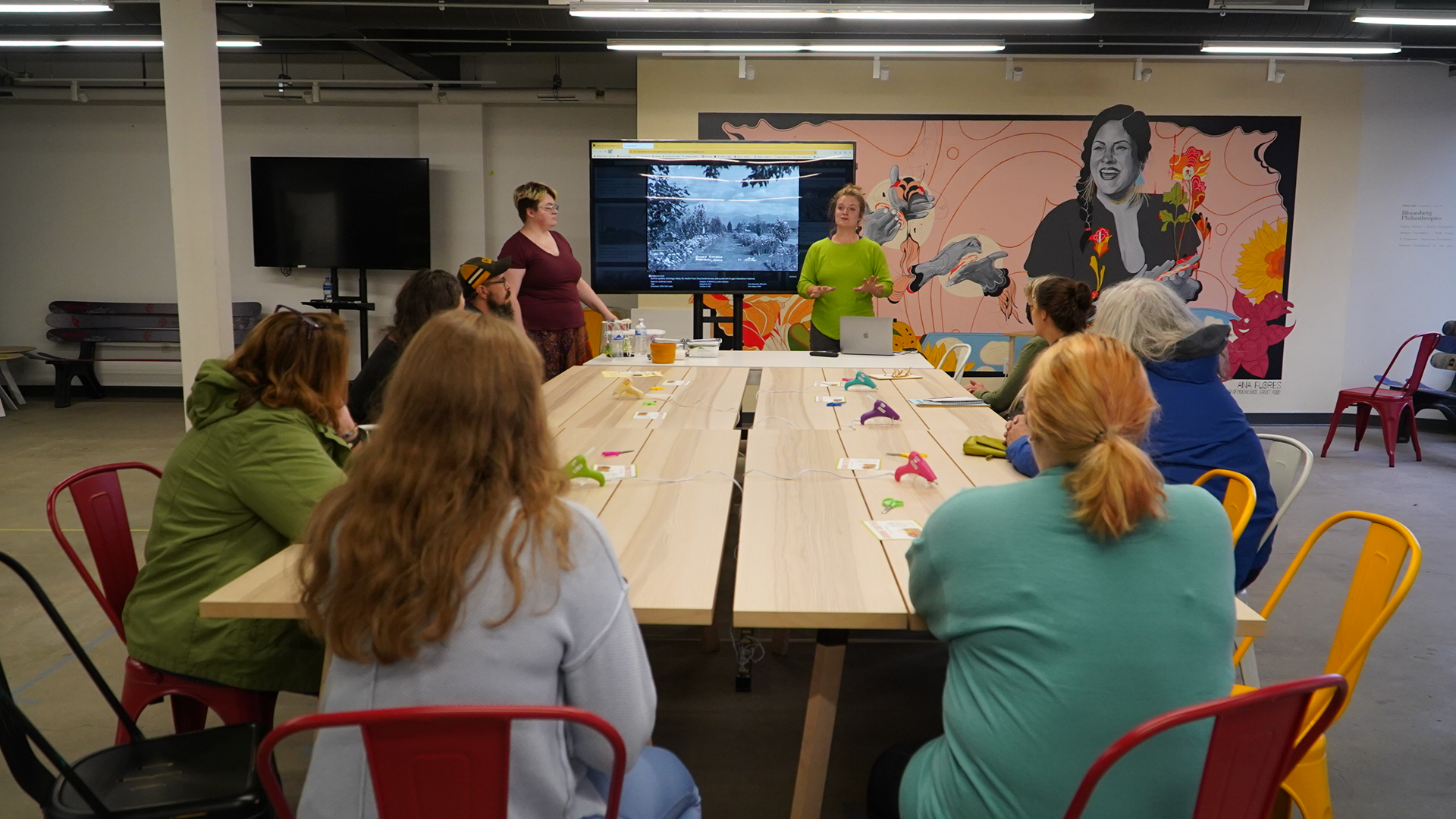 Participants at a round table discussion about gardening and herbs.